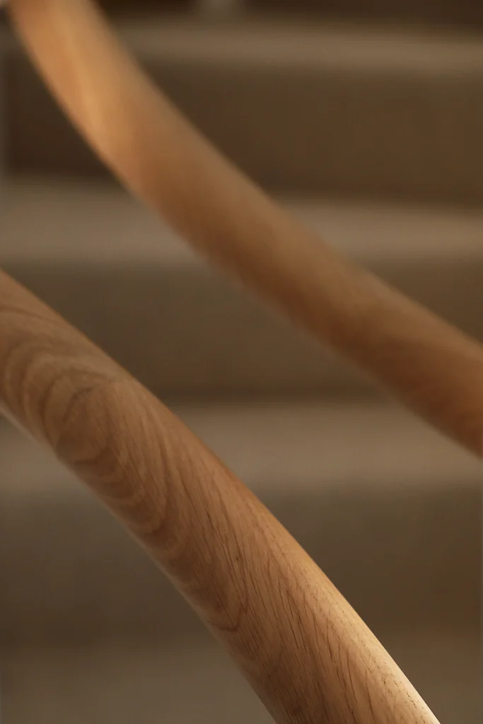 Close-up of timber staircase railing with smooth joinery finish