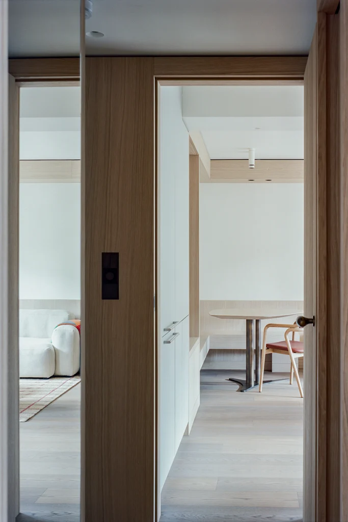 View through oak-framed internal door, revealing living area